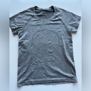 Gray Lululemon swiftly tee; tech race length, size four